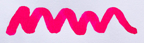 Wavy pink line on a white background. Diamine Hope Pink fountain pen ink colour swatch.