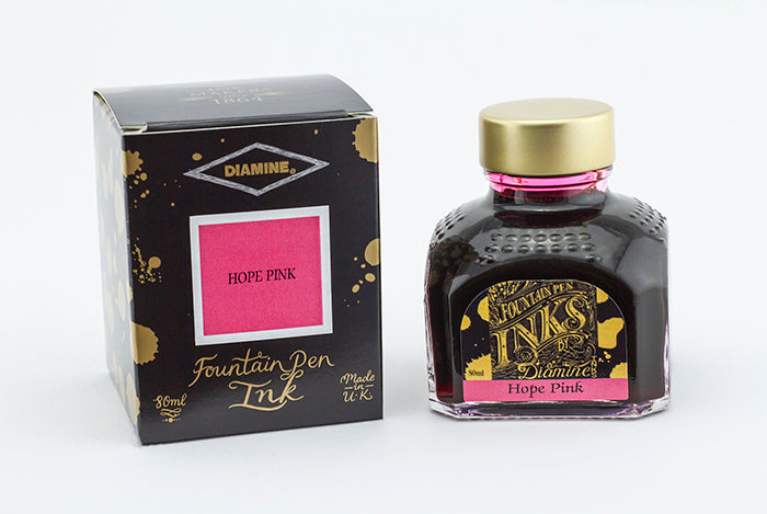 Diamine Hope Pink fountain pen ink bottle and packaging on a white background.