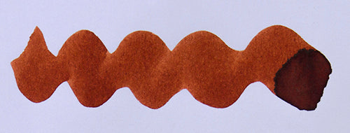 Wavy brown line on a white background. Diamine Cherry Sunburst fountain pen ink colour swatch.