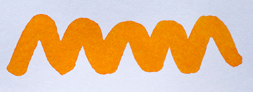 Wavy orange yellow line on a white background. Diamine Marigold fountain pen ink colour swatch.