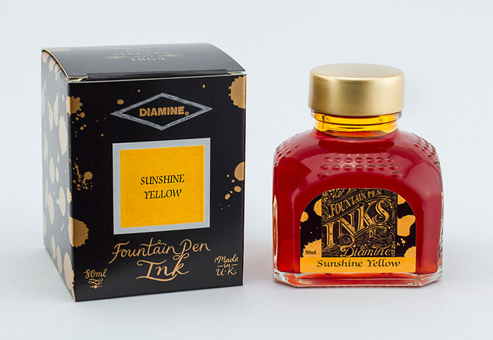 Diamine Sunshine Yellow fountain pen ink bottle and packaging on a white background.