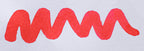Wavy pink line on a white background. Diamine Flamingo Pink fountain pen ink colour swatch.