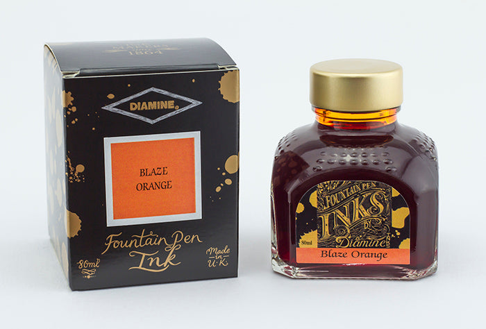 Diamine Blaze Orange fountain pen ink bottle and packaging on a white background.
