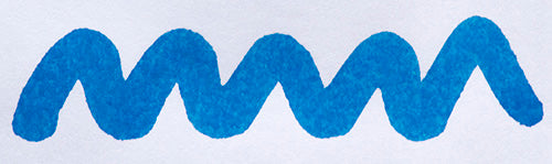 Wavy blue line on a white background. Diamine Mediterranean Blue fountain pen ink colour swatch.