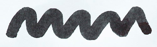 Wavy grey black line on a white background. Diamine Quartz Black fountain pen ink colour swatch.