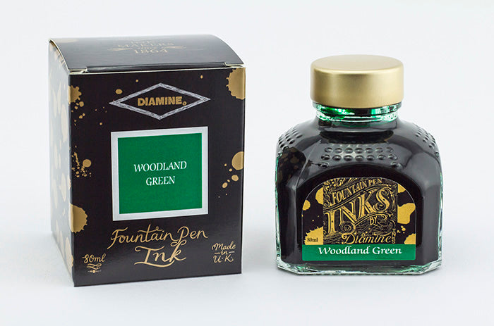 Diamine Woodland Green fountain pen ink bottle and packaging on a white background.