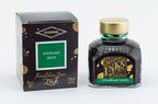 Diamine Woodland Green fountain pen ink bottle and packaging on a white background.