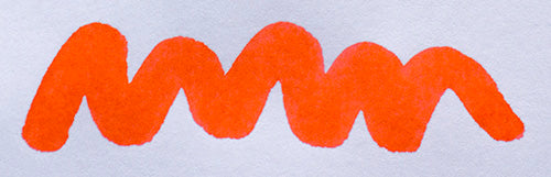 Wavy coral line on a white background. Diamine Coral fountain pen ink colour swatch.