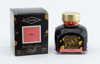 Diamine Coral fountain pen ink bottle and packaging on a white background.