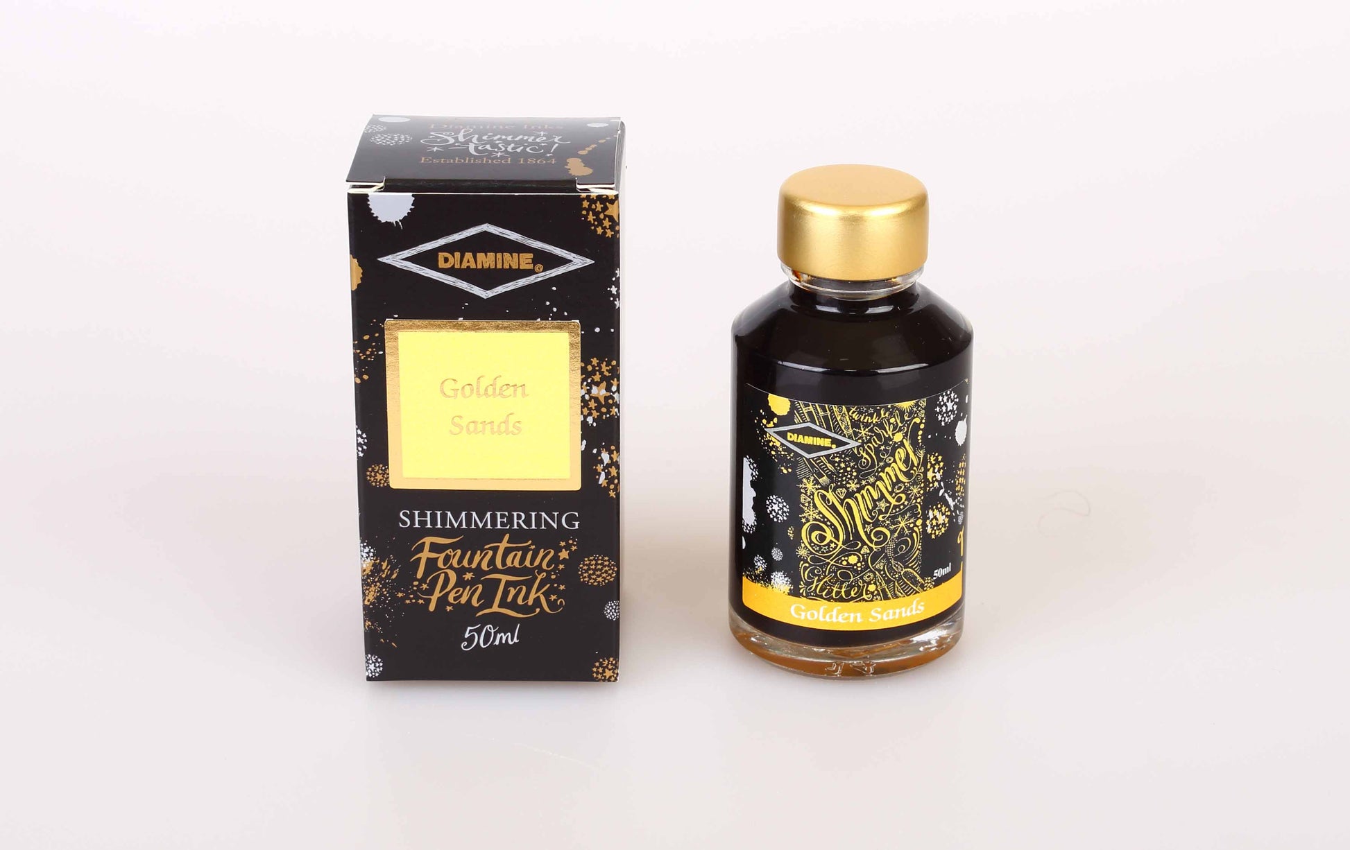Diamine Golden Sands fountain pen ink bottle and packaging on a white background.