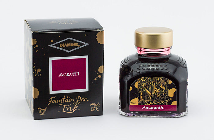 Diamine Amaranth fountain pen ink bottle and packaging on a white background.