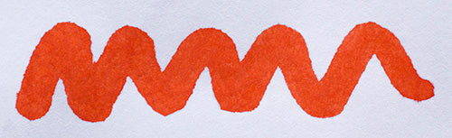Wavy orange line on a white background. Diamine Vermillion fountain pen ink colour swatch.
