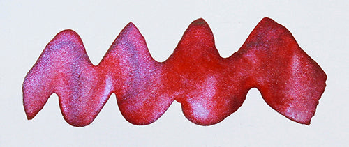 Wavy red line on a white background. Diamine Red Sky fountain pen ink colour swatch.