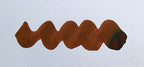 Wavy brown line on a white background. Diamine Nutcracker fountain pen ink colour swatch.