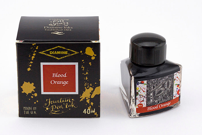 Diamine Blood Orange fountain pen ink bottle and packaging on a white background.