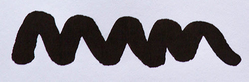 Wavy black line on a white background. Diamine Onyx Black fountain pen ink colour swatch.