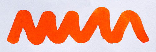 Wavy orange line on a white background. Diamine Pumpkin fountain pen ink colour swatch.