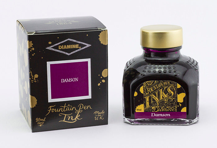 Diamine Damson fountain pen ink bottle and packaging on a white background.
