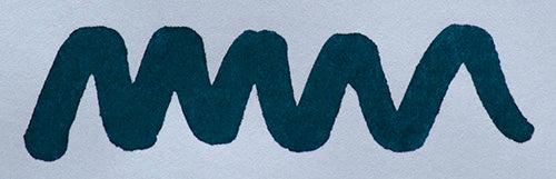 Wavy blue line on a white background. Diamine Midnight fountain pen ink colour swatch.