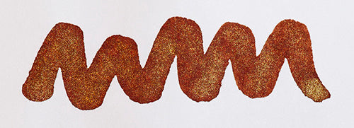 Wavy brown line on a white background. Diamine Brandy Dazzle fountain pen ink colour swatch.