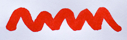 Wavy red line on a white background. Diamine Brilliant Red fountain pen ink colour swatch.