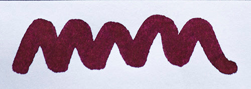 Wavy purple line on a white background. Diamine Handel fountain pen ink colour swatch.