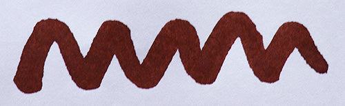 Wavy brown line on a white background. Diamine Rustic Brown fountain pen ink colour swatch.