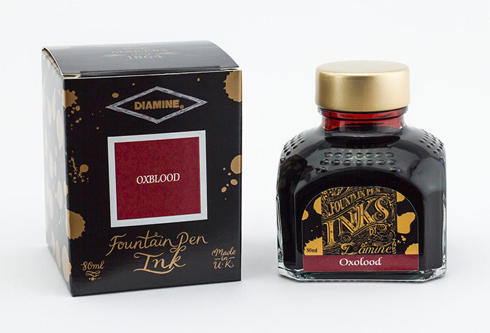 Diamine Oxblood fountain pen ink bottle and packaging on a white background.