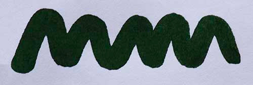 Wavy green line on a white background. Diamine Green Black fountain pen ink colour swatch.