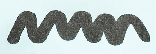 Wavy grey line on a white background. Diamine Graphite fountain pen ink colour swatch.