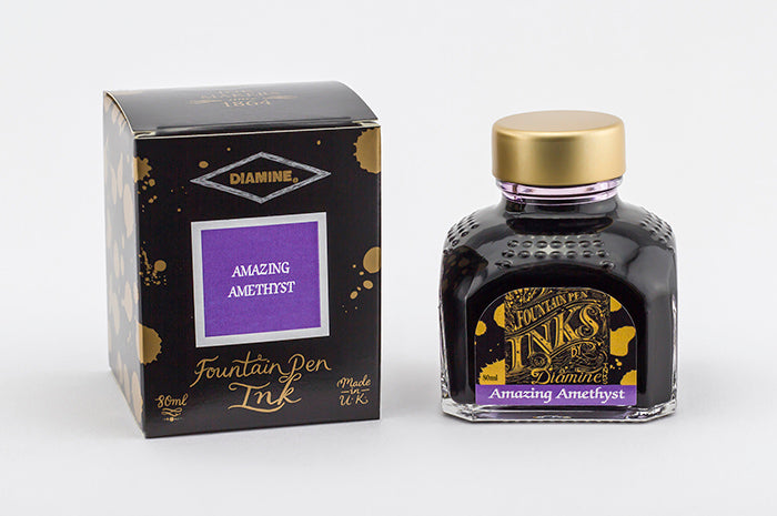 Diamine Amazing Amethyst fountain pen ink bottle and packaging on a white background.