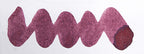 Wavy purple line on a white background. Diamine Harmony fountain pen ink colour swatch.