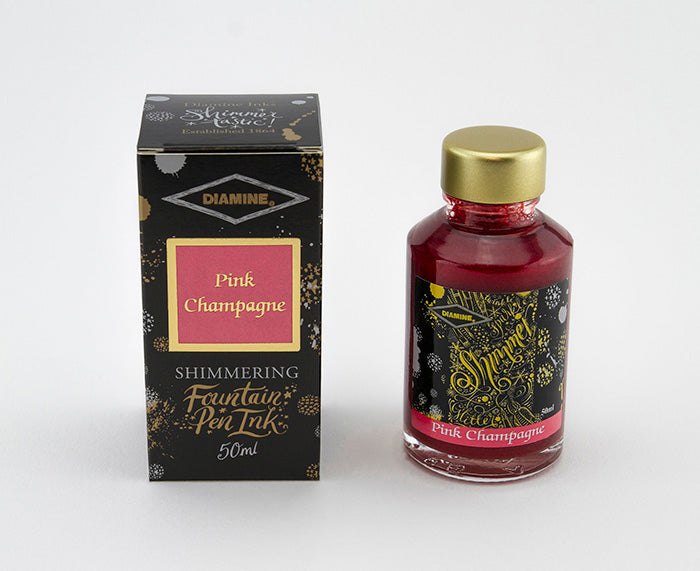 Diamine Pink Champagne fountain pen ink bottle and packaging on a white background.