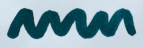 Wavy blue line on a white background. Diamine Denim fountain pen ink colour swatch.