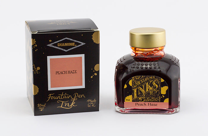 Diamine Peach Haze fountain pen ink bottle and packaging on a white background.