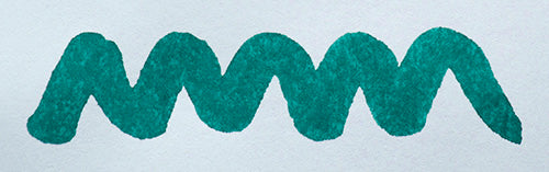 Wavy teal line on a white background. Diamine Eau de Nil fountain pen ink colour swatch.