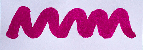 Wavy pink line on a white background. Diamine Bougainvillea fountain pen ink colour swatch.