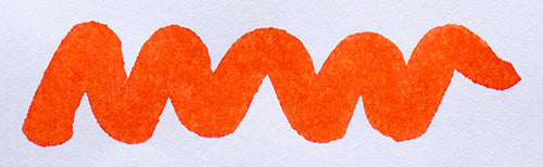 Wavy orange line on a white background. Diamine Sunset fountain pen ink colour swatch.