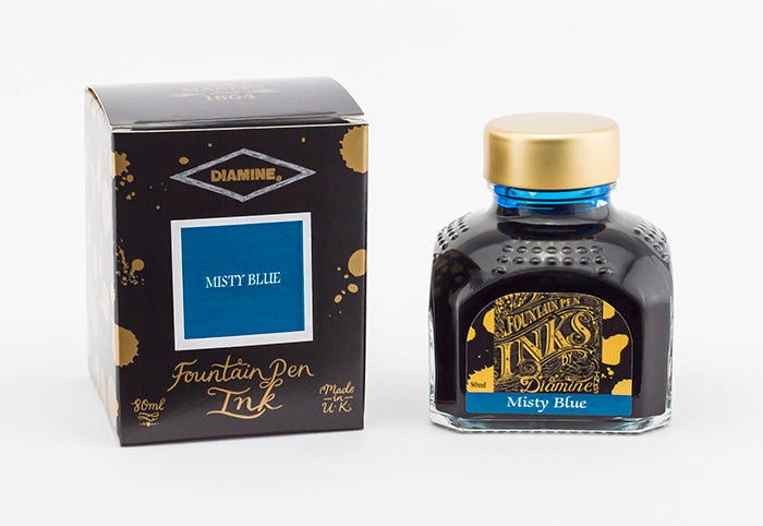 Diamine Misty Blue fountain pen ink bottle and packaging on a white background.