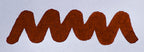 Wavy orange brown line on a white background. Diamine Ancient Copper fountain pen ink colour swatch.