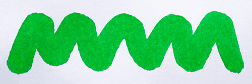 Wavy green line on a white background. Diamine Apple Glory fountain pen ink colour swatch.