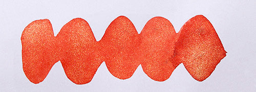 Wavy coral line on a white background. Diamine Celebration fountain pen ink colour swatch.
